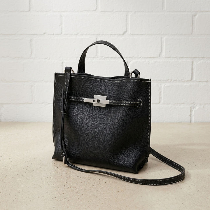 Black Soft Grain Mini Shoulder Bag with textured leather, silver-tone hardware, top handle, and adjustable crossbody strap.