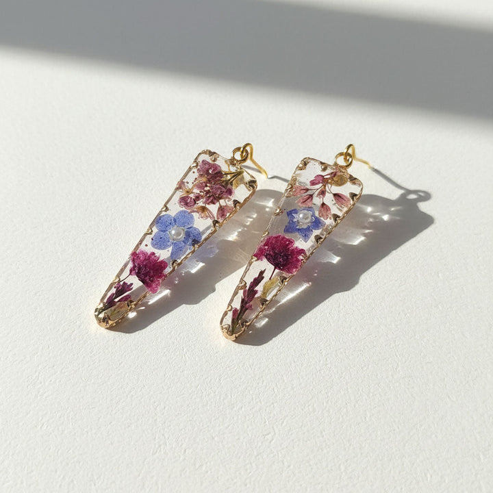 Pair of floral hair clips on a white background