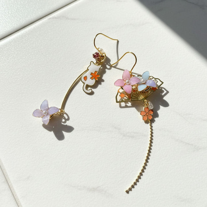 Floral earrings with gold accents on a light background