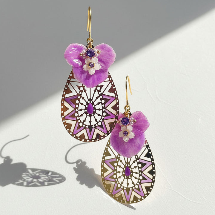 Purple floral mandala drop earrings with MOP shell and CZ stones on white background
