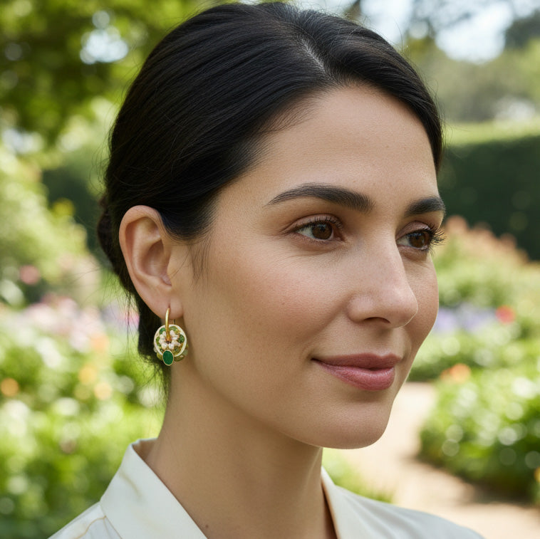 Model wearing green cloisonné floral earrings outdoors