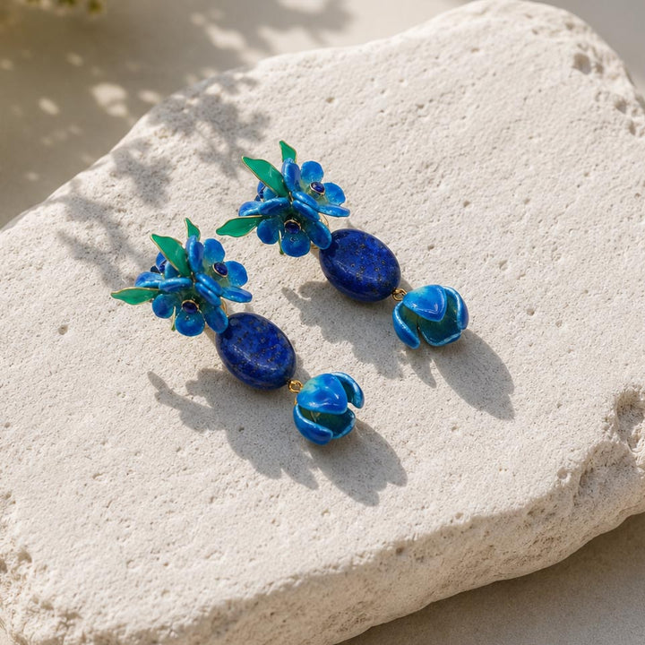 Forget me not flower earrings photographed outdoors in warm natural sunlight