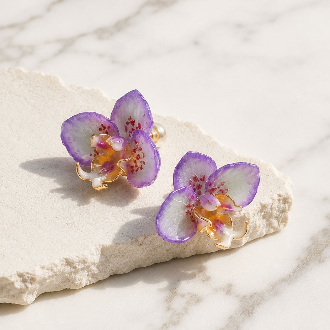 Handcrafted orchid flower earrings with purple resin petals and gold-plated detailing