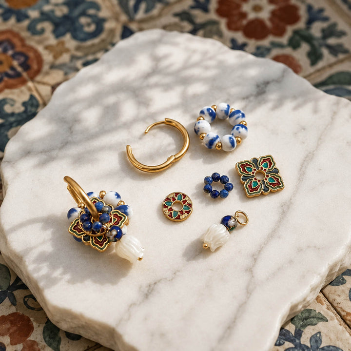 Blue porcelain convertible hoop earrings with hand-painted enamel medallions, lapis bead accents and hand-carved mother of pearl tulip charms.