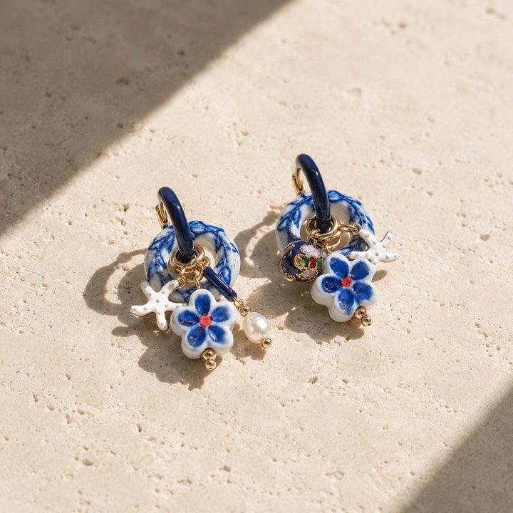 A2K handcrafted convertible hoop earrings featuring blue and white porcelain with cloisonne charms.