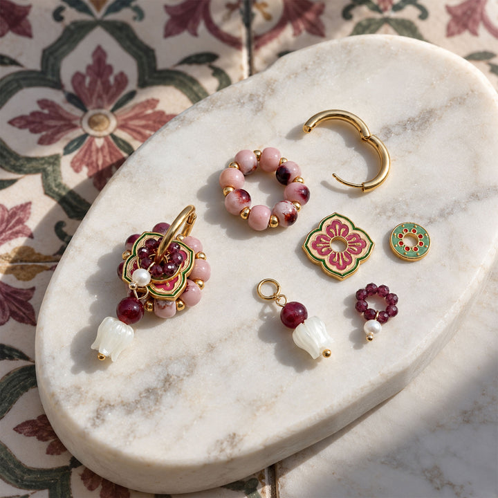 Convertible hoop earrings with garnet, mother-of-pearl tulips, hand-painted porcelain and enamel charms.