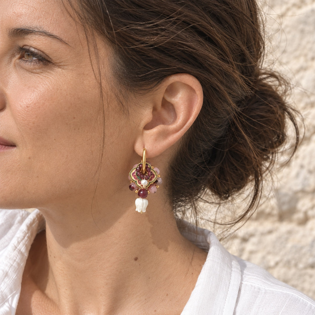 Model wearing garnet and mother-of-pearl tulip convertible hoop earrings.