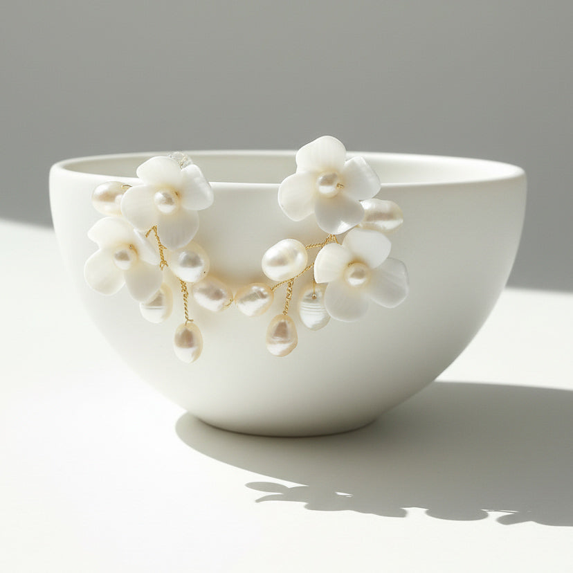 White ceramic bowl with floral decorations on a gray background