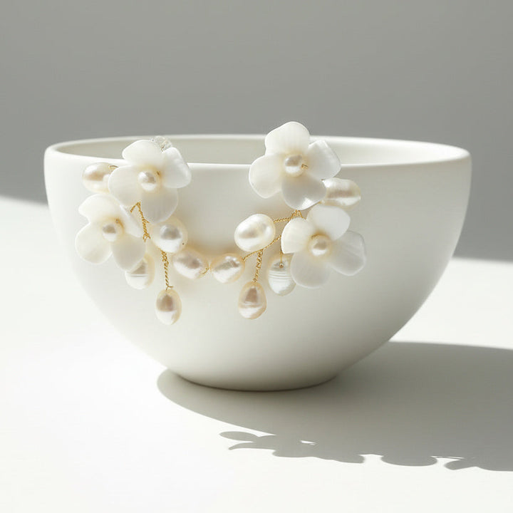 White ceramic bowl with floral decorations on a gray background
