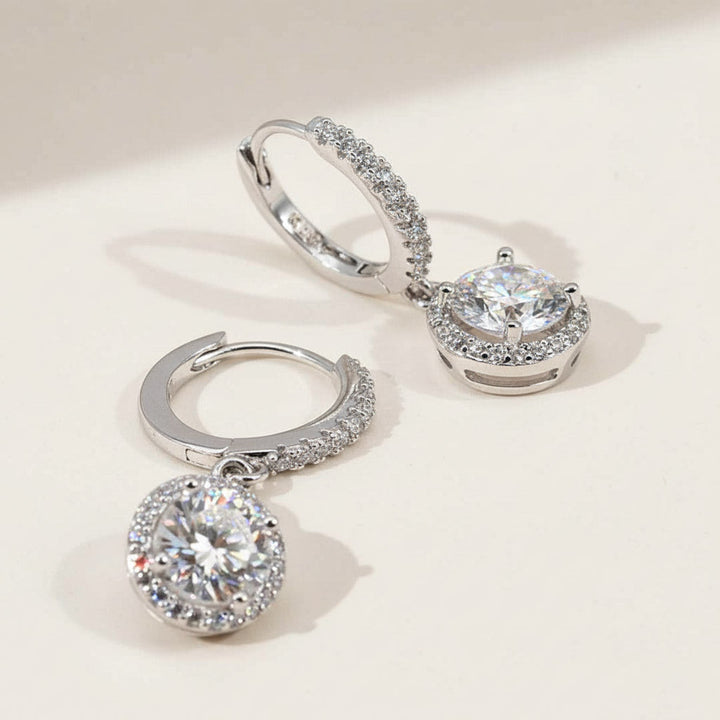 Side view of halo lab-grown diamond drop earrings with silver hoops