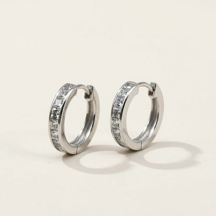 Pair of platinum-plated silver hoop earrings with channel-set princess-cut CZ stones