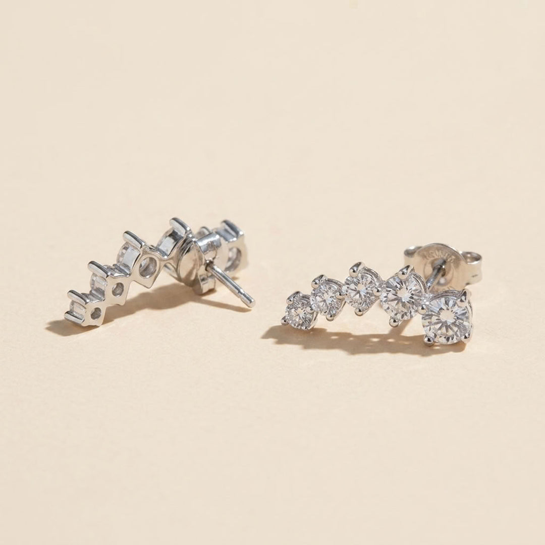 Side and back view of graduated moissanite ear climber earrings in 925 sterling silver