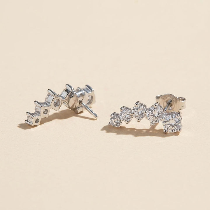 Side and back view of graduated moissanite ear climber earrings in 925 sterling silver