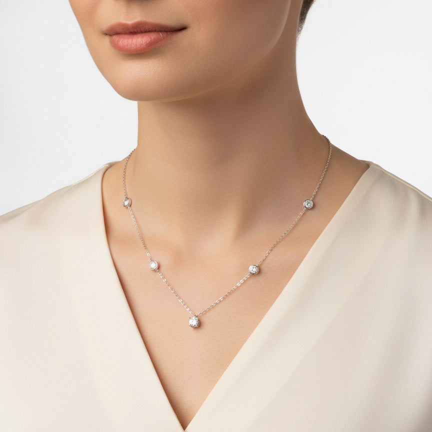Model wearing moissanite pendant necklace with 1ct center stone