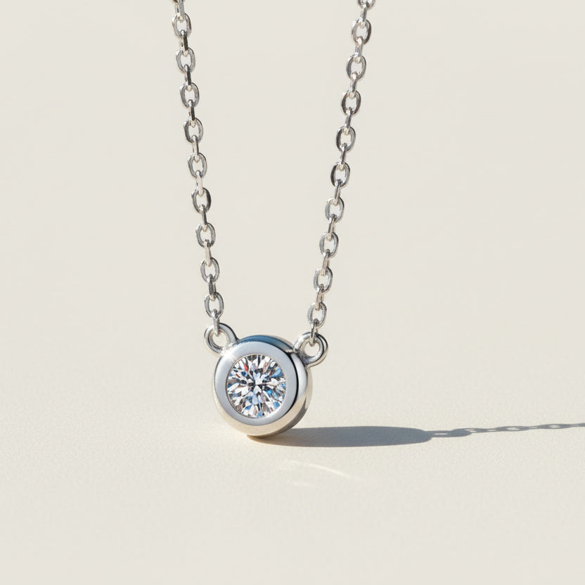 Bezel set moissanite necklace in sterling silver, 0.5ct round lab diamond.