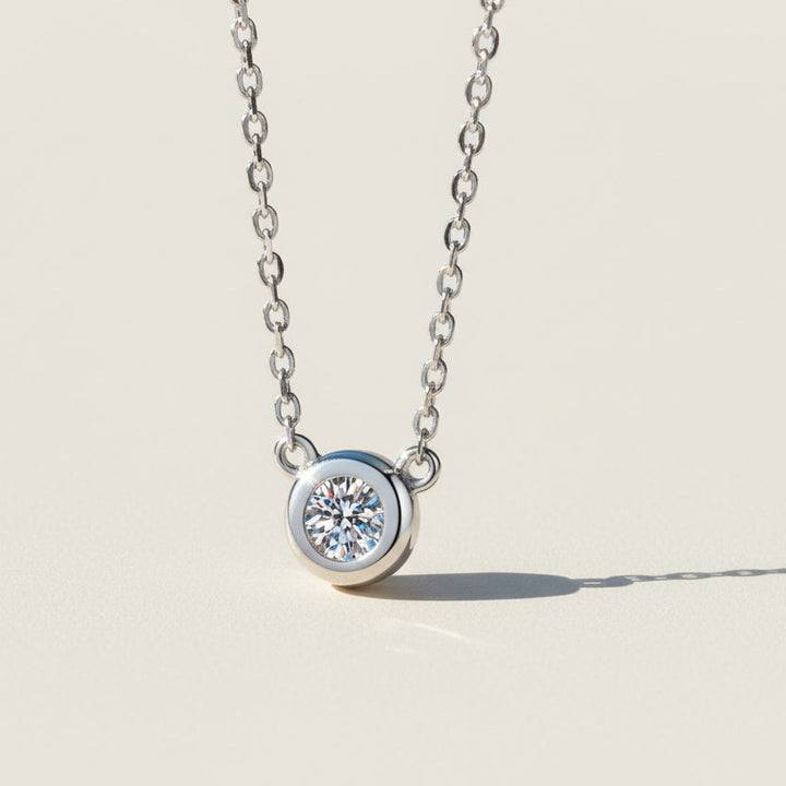 Bezel set moissanite necklace in sterling silver, 0.5ct round lab diamond.