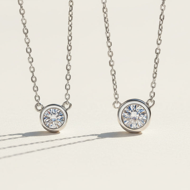 Bezel moissanite necklace in 0.5ct and 1ct size comparison, sterling silver.
