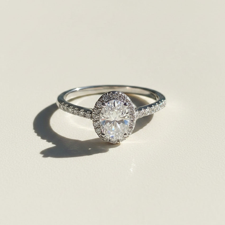Moissanite diamond ring on a light beige background