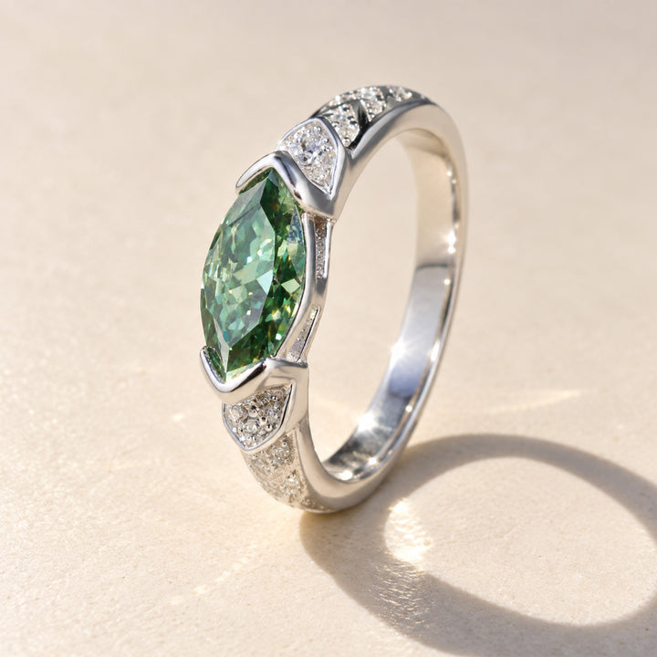 Close-up side view of 1 carat green marquise Guardian Eye moissanite ring in platinum-plated sterling silver