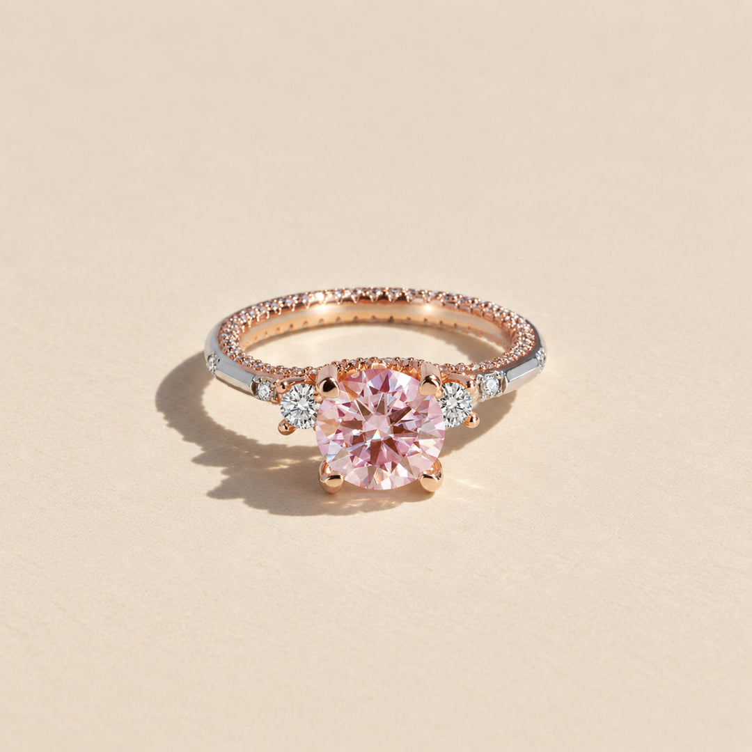 Front view of 2 carat round pink moissanite ring with silver and rose gold two-tone setting