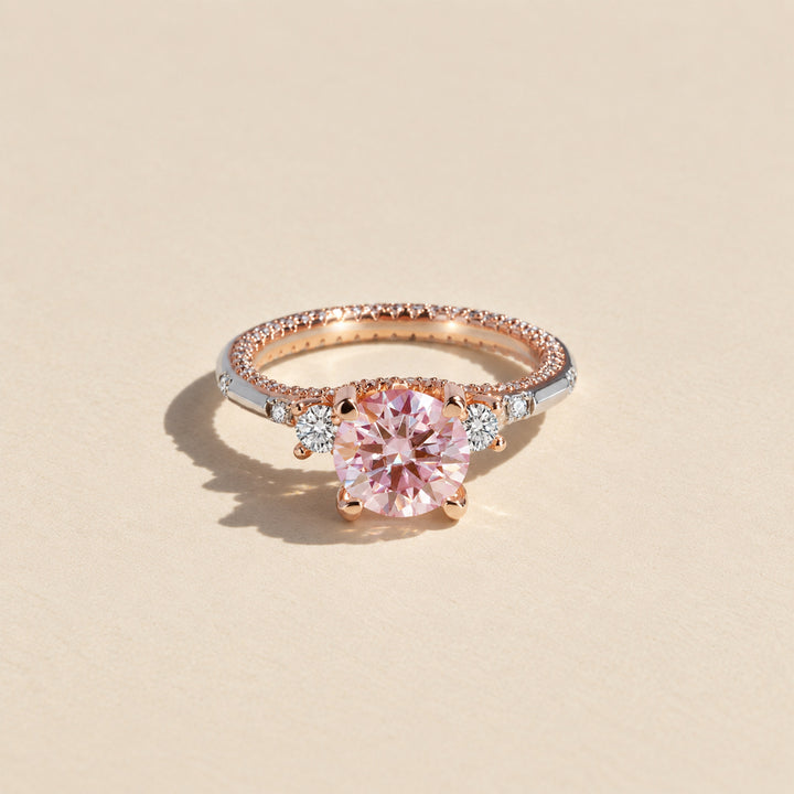 Front view of 2 carat round pink moissanite ring with silver and rose gold two-tone setting