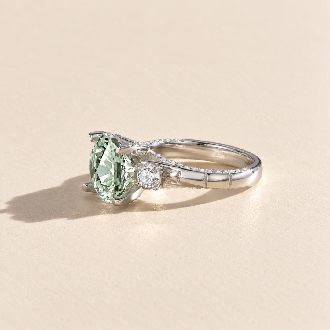 Side profile of green moissanite ring showing the raised 5 carat center stone and pavé band