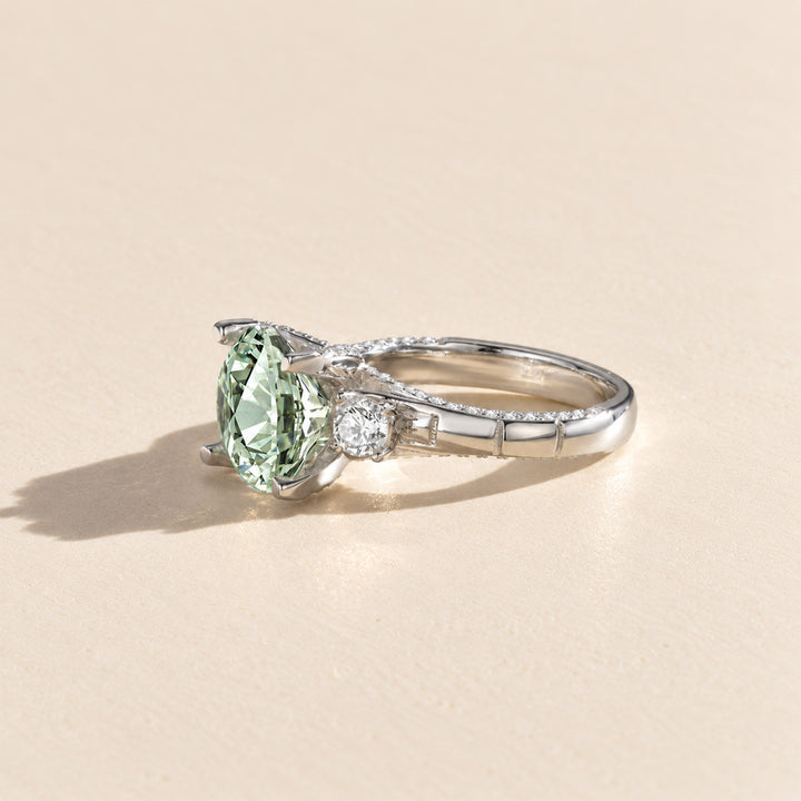 Side profile of green moissanite ring showing the raised 5 carat center stone and pavé band