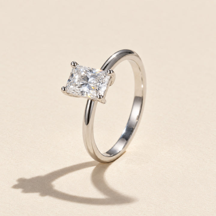 Side view of radiant-cut moissanite solitaire ring showing the polished 925 sterling silver band