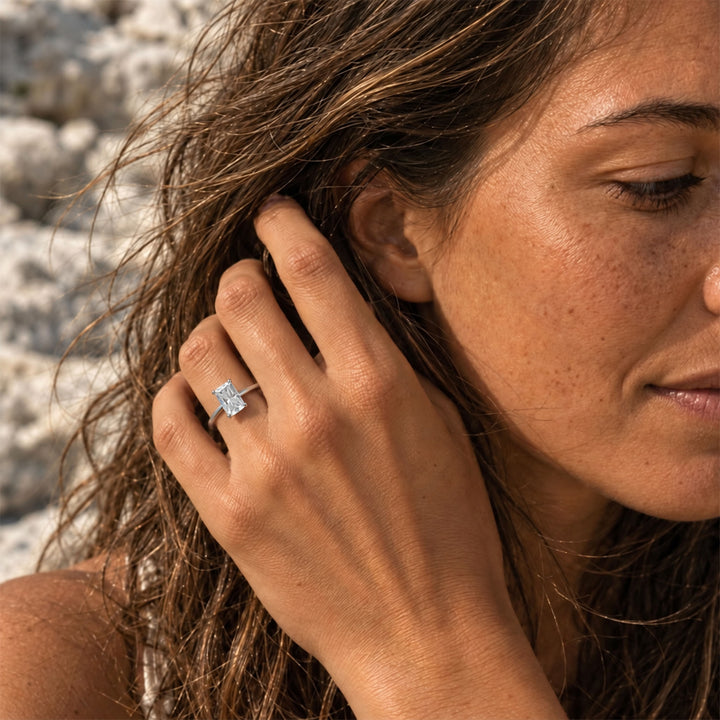 1 carat radiant-cut moissanite ring worn on hand in natural sunlight