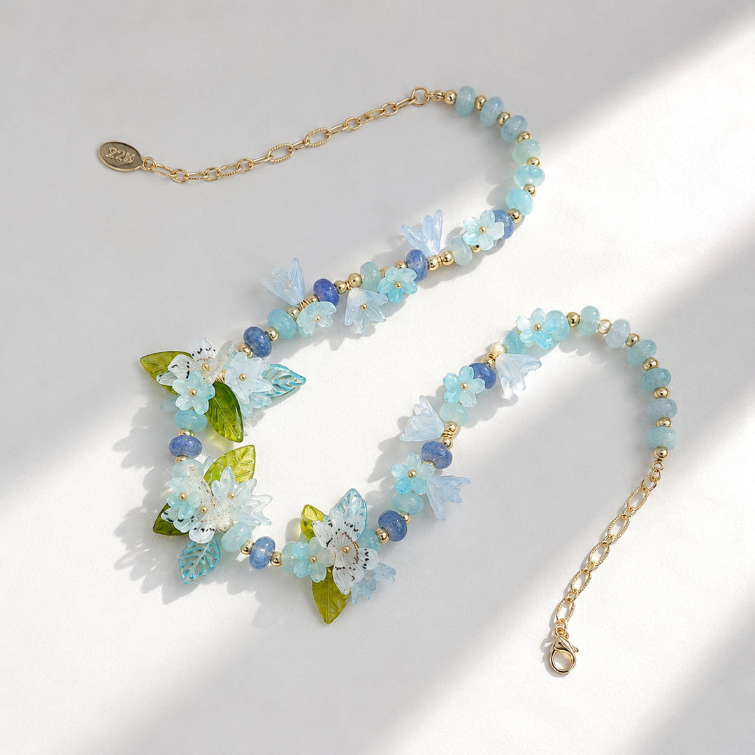 Necklace with floral and bead design on a light background