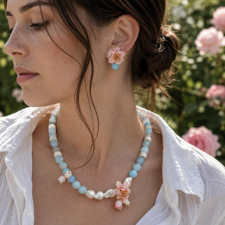 Woman wearing a matching Lotus Amazonite Necklace and Pink Lotus Amazonite Stud Earrings with Hand-Painted Floral Details