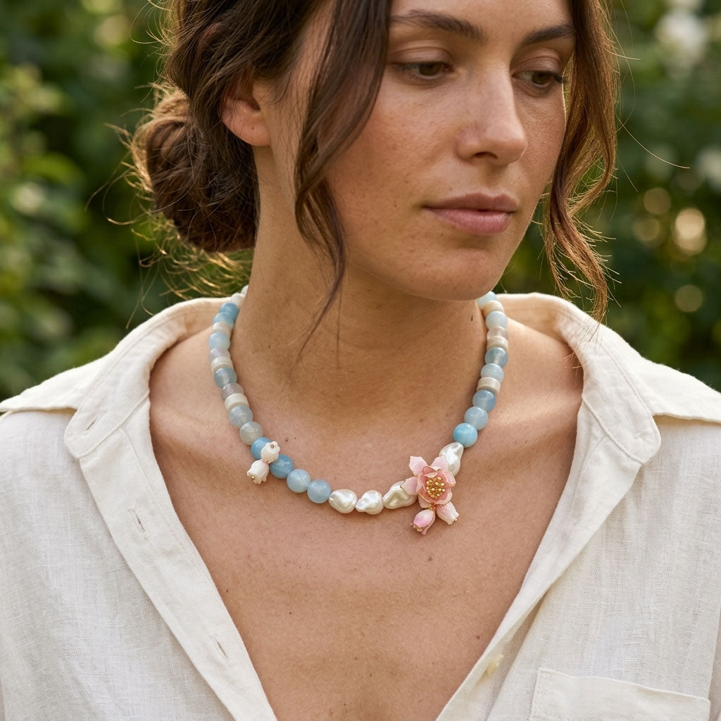 Woman wearing Lotus Amazonite Necklace with Hand-Painted Lotus Flower floral pendant outdoors