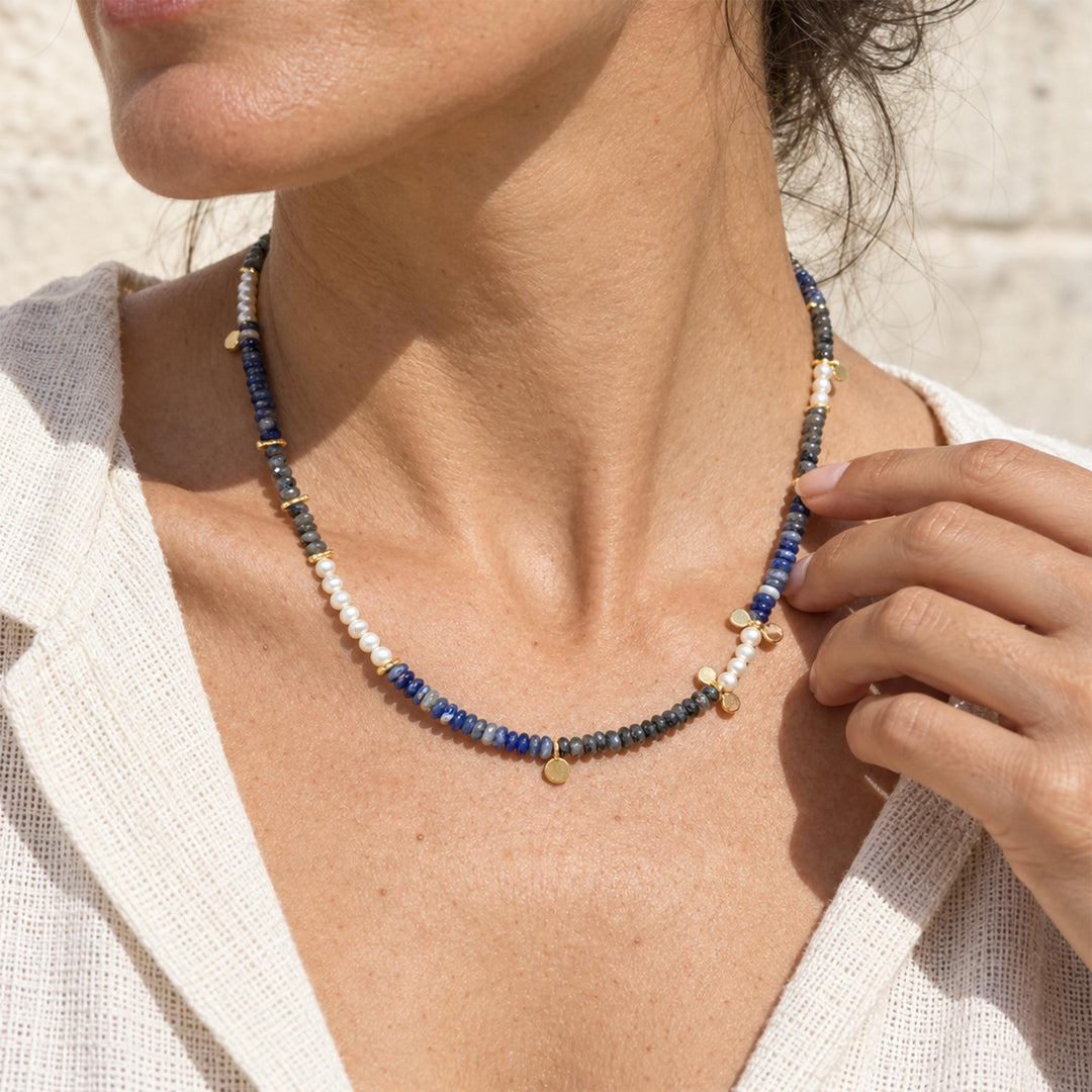 Model wearing Black Labradorite and Sodalite pearl necklace with mixed blue and smoky gemstone sections