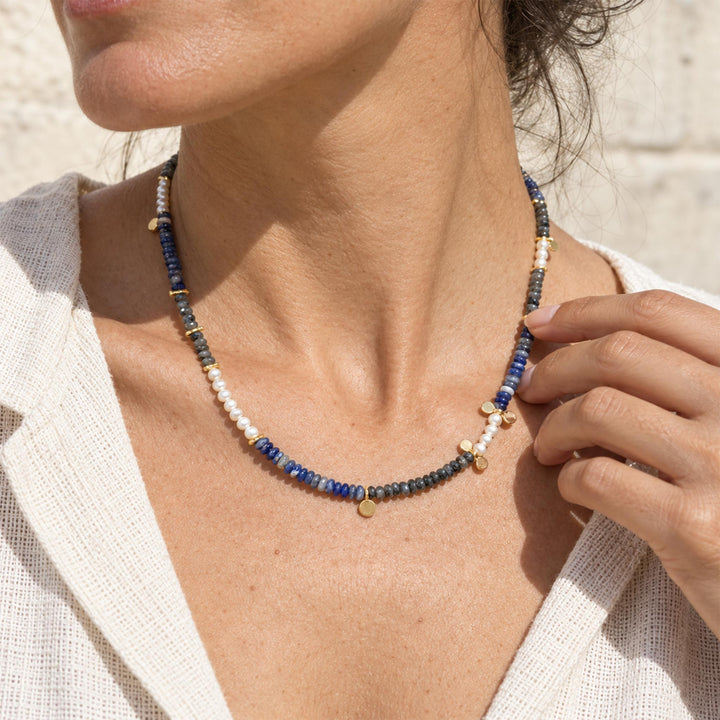 Model wearing Black Labradorite and Sodalite pearl necklace with mixed blue and smoky gemstone sections