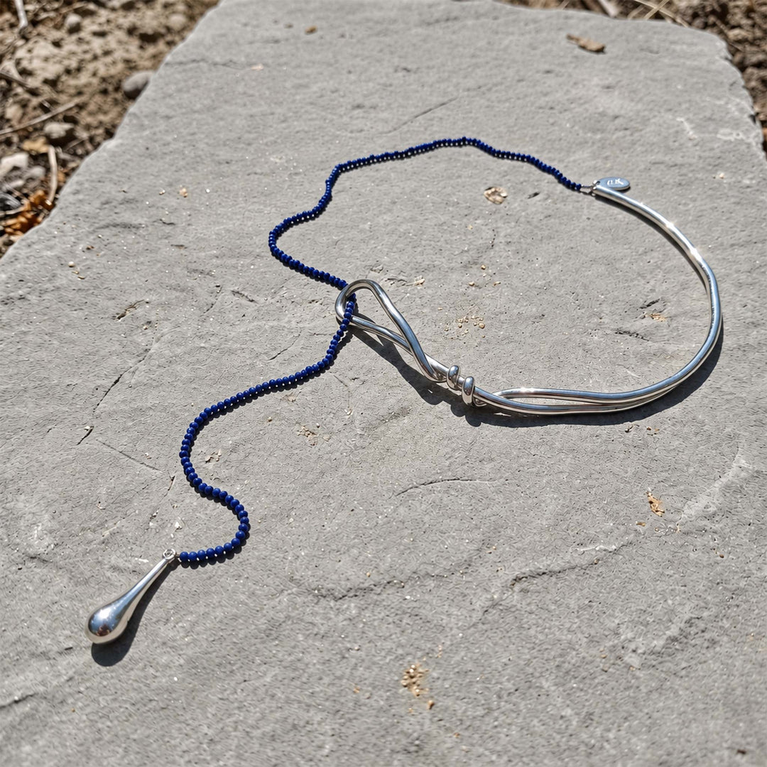 Lapis Lazuli Curve Collar Necklace with faceted blue beads and silver-plated brass teardrop detail