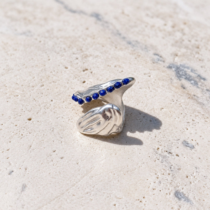 Side view of Lapis Lazuli Open Curve Ring showing adjustable silver-plated brass construction