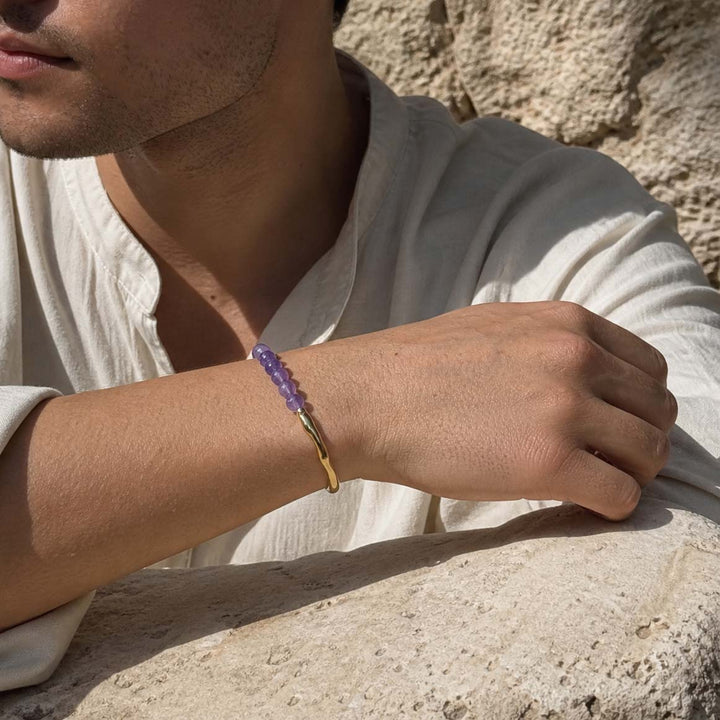 Man wearing amethyst beaded hook bracelet with gold accents