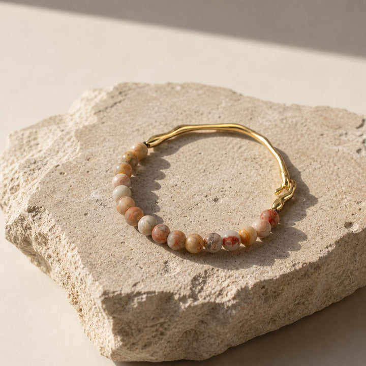 Neutral toned gemstone hook bracelet with matte stone beads and gold accents