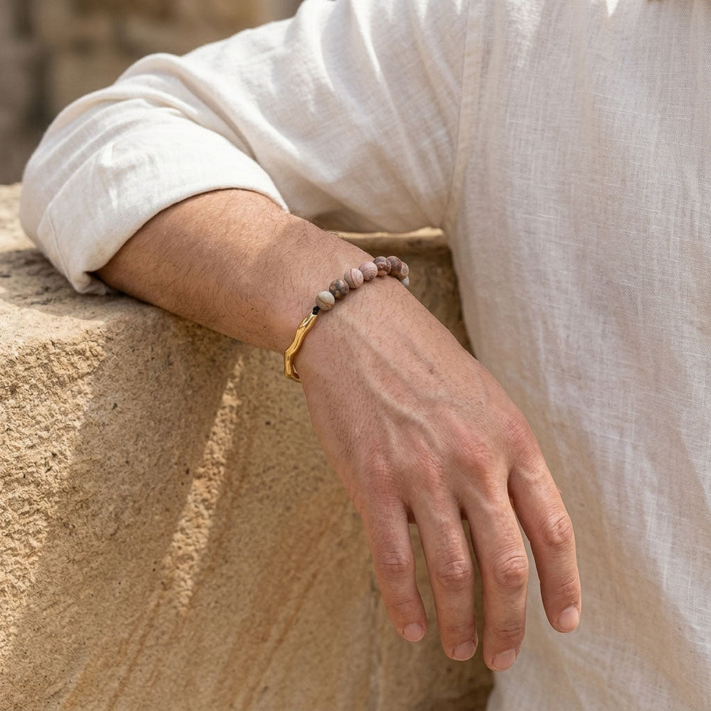 Man wearing crazy lace agate gemstone bracelet with gold stainless steel hook