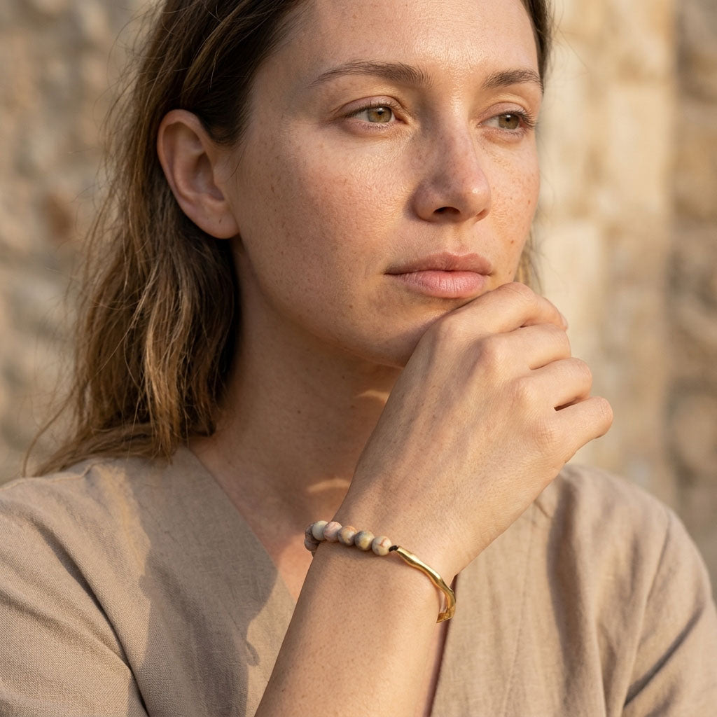 Woman wearing crazy lace agate bracelet in sunlight