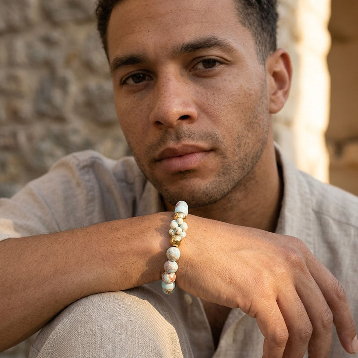 Man wearing Shoushan stone beaded bracelet set with gold accent beads