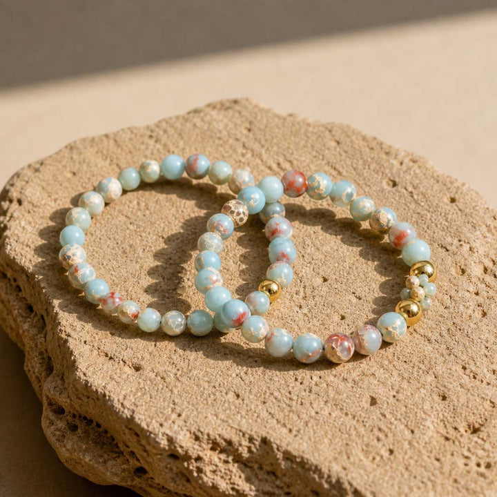 Shoushan stone bracelet set styled on natural beige stone surface