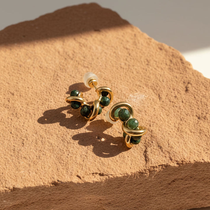 Sculptural stud earrings with Indian agate beads on terracotta stone