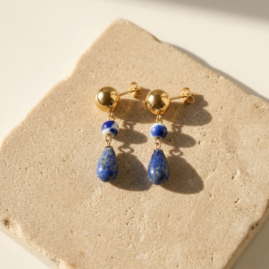 Handcrafted lapis lazuli teardrop earrings with porcelain bead accents