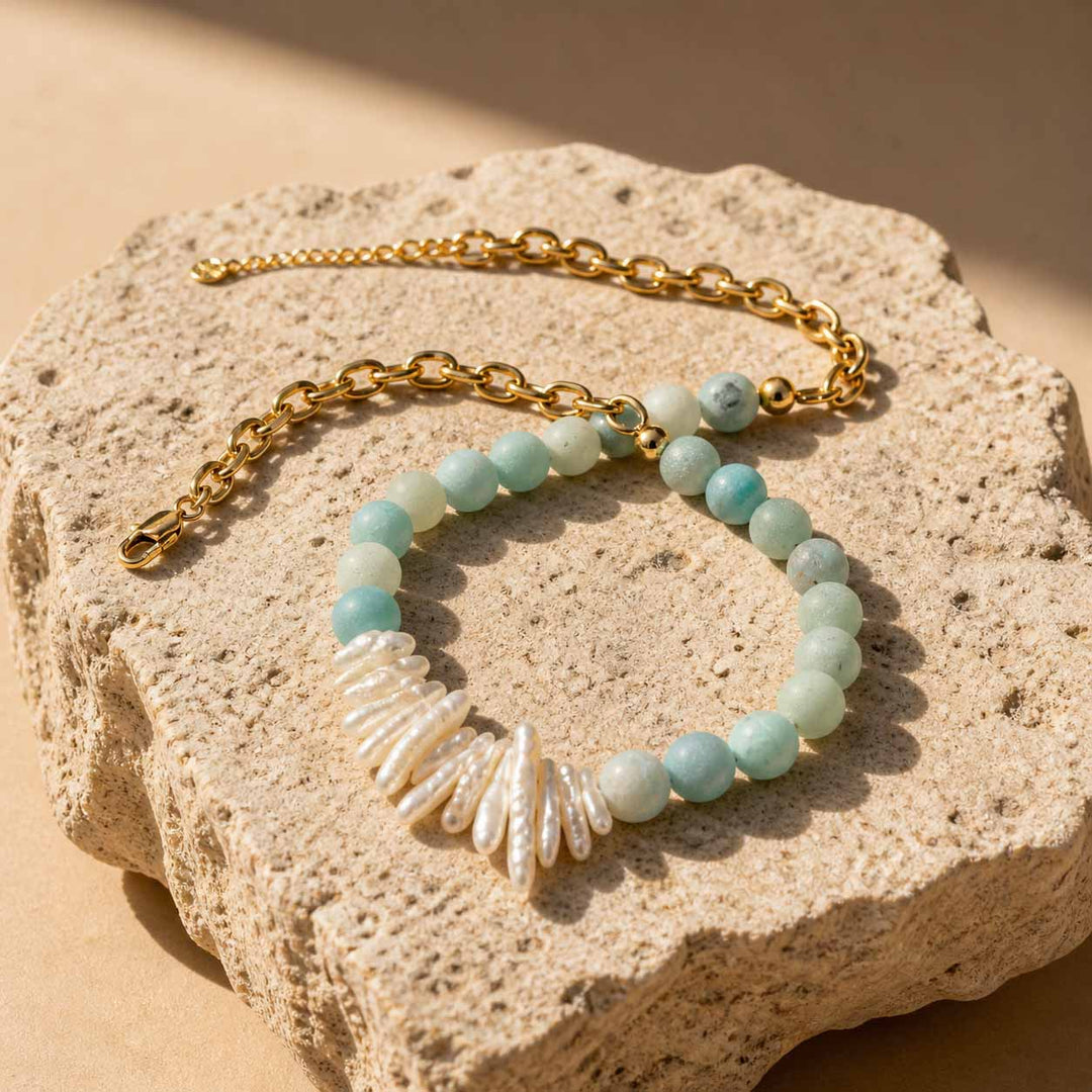 Amazonite and pearl necklace with gold chain flat lay