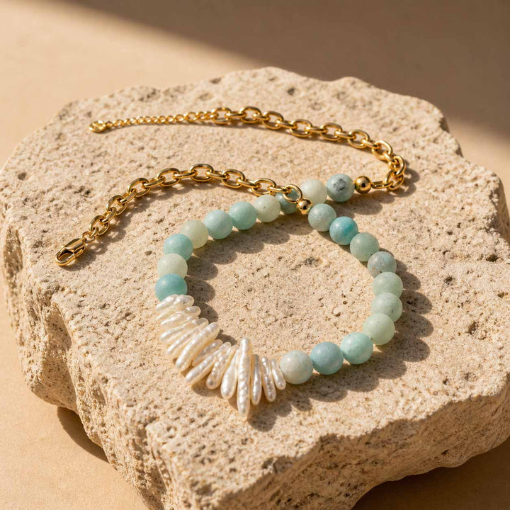 Amazonite and pearl necklace with gold chain flat lay