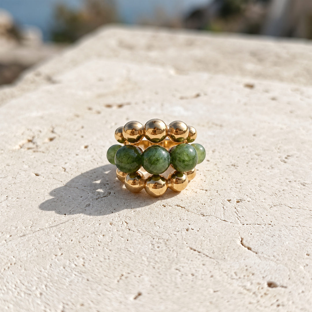 Front view of Green Tourmaline Cluster Ring with layered green gemstone beads and polished gold setting