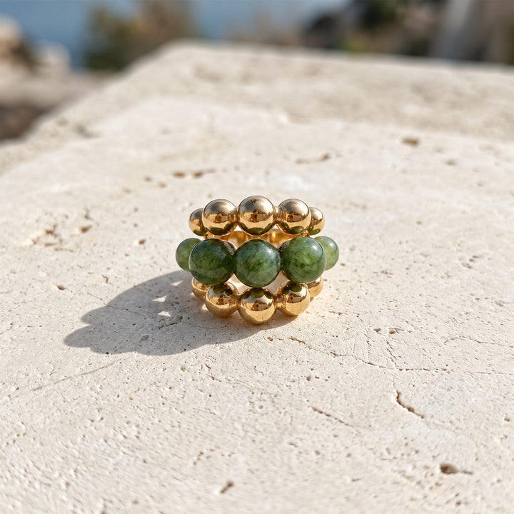 Front view of Green Tourmaline Cluster Ring with layered green gemstone beads and polished gold setting