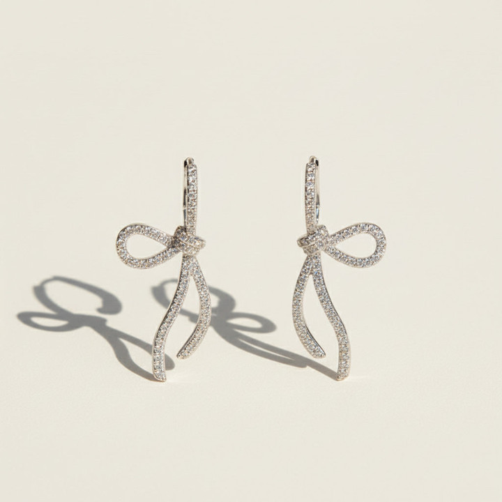 Bow Moissanite Drop Earrings in Platinum Plated Silver