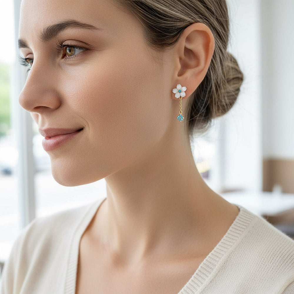 Woman wearing a floral earring with a blurred background